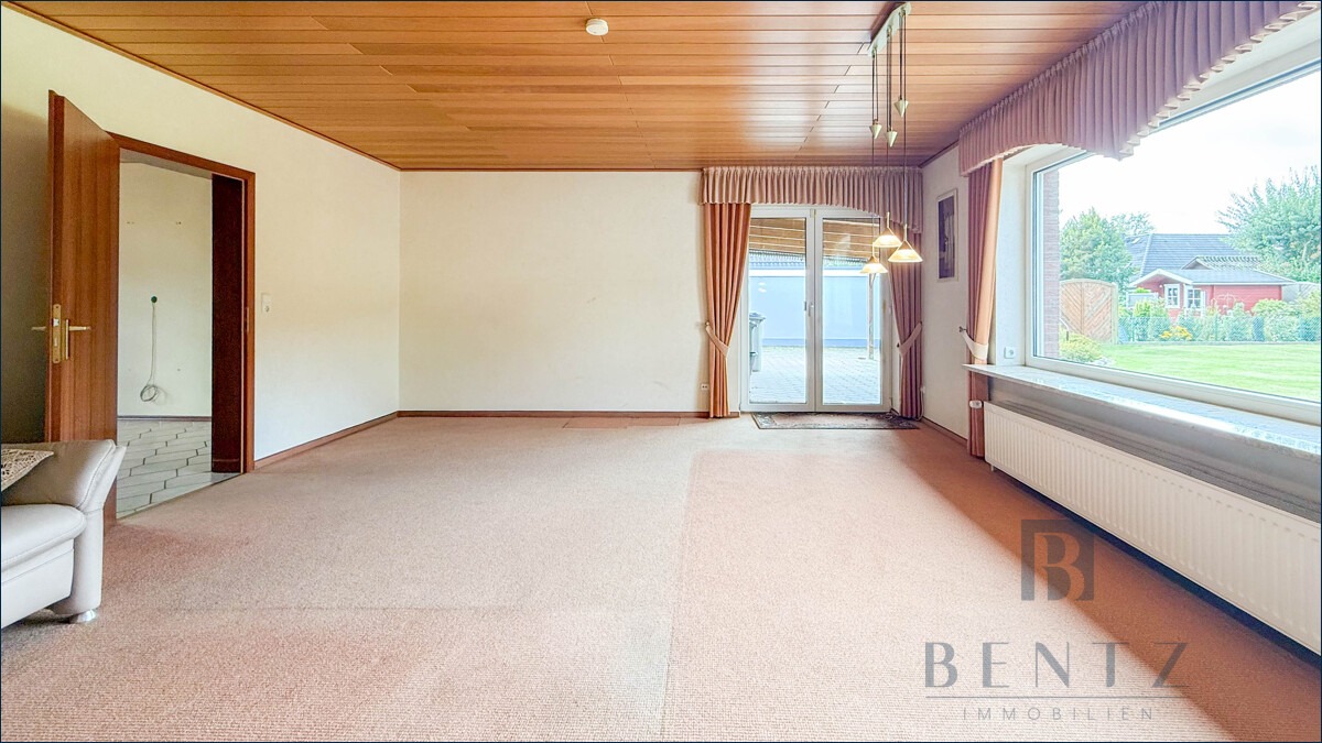 Wohnzimmer mit Zugang zur Terrasse